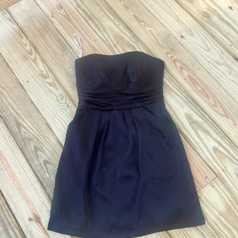 Black David’s Bridal cocktail dress with pockets.